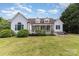 The well-manicured backyard features a deck with a jacuzzi and a lush green lawn at 14807 Middlesborough Dr, Matthews, NC 28104