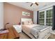 Serene bedroom with a cozy bed, natural light, and stylish decor at 14807 Middlesborough Dr, Matthews, NC 28104