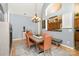Dining area with a chandelier and seating for four with views of the kitchen creating an inviting atmosphere at 14807 Middlesborough Dr, Matthews, NC 28104