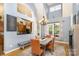 Elegant dining room boasts a modern chandelier, ample natural light, and seating for six at 14807 Middlesborough Dr, Matthews, NC 28104