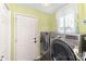 Functional laundry room with modern washer and dryer units, offering convenience at 14807 Middlesborough Dr, Matthews, NC 28104
