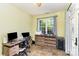 Bright office space featuring large windows, modern desk setup, and ample natural light at 14807 Middlesborough Dr, Matthews, NC 28104
