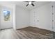 A bright bedroom with wood floors and a ceiling fan offering a simple and comfortable space at 149 Shady Cove Rd, Troutman, NC 28166