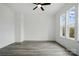 Inviting bedroom featuring hardwood floors, ceiling fan, and natural light at 149 Shady Cove Rd, Troutman, NC 28166