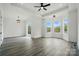Bright bedroom features natural light from the oversized windows, a ceiling fan, and stylish light fixture at 149 Shady Cove Rd, Troutman, NC 28166