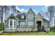 Charming two-story home featuring stone accents, a covered porch, and a beautifully landscaped yard at 149 Shady Cove Rd, Troutman, NC 28166