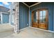 Elegant double front doors with glass panels and craftsman detailing at 149 Shady Cove Rd, Troutman, NC 28166