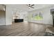 Bright open-plan living area with modern finishes, including a large island and plenty of natural light at 149 Shady Cove Rd, Troutman, NC 28166