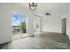 Bright living room with sliding doors to balcony showcasing scenic water views at 149 Shady Cove Rd, Troutman, NC 28166
