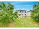 The backyard features a well-maintained lawn and a patio, complemented by mature trees at 1507 Arcadia Bluff Dr, York, SC 29745