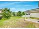 Spacious backyard featuring a covered patio, lush grass, and a privacy fence at 1507 Arcadia Bluff Dr, York, SC 29745