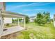 Expansive backyard featuring trees, lawn, a covered patio, and fencing at 1507 Arcadia Bluff Dr, York, SC 29745