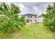 The backyard features a well-maintained lawn and a patio, complemented by mature trees at 1507 Arcadia Bluff Dr, York, SC 29745