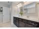 Bathroom boasts a double vanity with dark cabinets, mirrors, and updated fixtures at 1507 Arcadia Bluff Dr, York, SC 29745