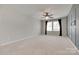 Spacious bedroom features a ceiling fan, large windows, and neutral carpeting at 1507 Arcadia Bluff Dr, York, SC 29745
