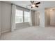 Large bedroom with neutral walls, large windows and ensuite door at 1507 Arcadia Bluff Dr, York, SC 29745