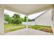 A covered patio leads to a spacious yard enclosed with a white fence offering a serene outdoor area at 1507 Arcadia Bluff Dr, York, SC 29745
