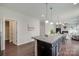 Open kitchen featuring an island with seating, granite countertops, and stainless steel appliances at 1507 Arcadia Bluff Dr, York, SC 29745