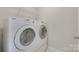 Convenient laundry room with washer, dryer, and shelving at 1507 Arcadia Bluff Dr, York, SC 29745