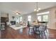 Open-concept living area featuring a fireplace, hardwood floors, and comfortable seating at 1507 Arcadia Bluff Dr, York, SC 29745
