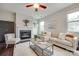 Cozy living room with a fireplace, plush seating, and hardwood floors at 1507 Arcadia Bluff Dr, York, SC 29745