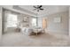 Bright main bedroom features neutral decor, tray ceiling, and ensuite access at 1507 Arcadia Bluff Dr, York, SC 29745
