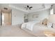 Bright main bedroom features neutral decor, tray ceiling, and ensuite access at 1507 Arcadia Bluff Dr, York, SC 29745