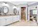 Bathroom featuring double sinks with granite countertop, vanity, a glass shower and framed mirrors at 162 Kenway Loop, Mooresville, NC 28117