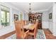 Traditional dining room offers a wooden table with seating for eight and a decorative hutch at 162 Kenway Loop, Mooresville, NC 28117