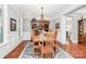 Spacious dining room boasts classic decor and a view into the kitchen, perfect for entertaining guests at 162 Kenway Loop, Mooresville, NC 28117