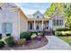 Inviting brick home featuring covered front porch and meticulous landscaping in desirable neighborhood at 162 Kenway Loop, Mooresville, NC 28117