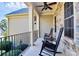 Comfortable front porch featuring rocking chairs, ceiling fans, and stone accents at 162 Kenway Loop, Mooresville, NC 28117