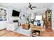 Bright living room with hardwood floors, fireplace, ceiling fan and built in shelving at 162 Kenway Loop, Mooresville, NC 28117