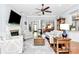 Bright living room with hardwood floors, fireplace, ceiling fan, columns and open concept floor plan at 162 Kenway Loop, Mooresville, NC 28117