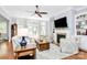 Cozy living room with fireplace, plush seating, and hardwood floors at 162 Kenway Loop, Mooresville, NC 28117