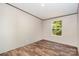 A simple bedroom has natural light and light flooring at 1785 Doe Ct, Iron Station, NC 28080