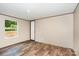 A cozy bedroom is displayed, complete with a neutral color scheme, vinyl floors, and an inviting source of natural light at 1785 Doe Ct, Iron Station, NC 28080