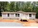New home exterior with small entry porch at 1785 Doe Ct, Iron Station, NC 28080