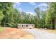 New home exterior with gravel driveway at 1785 Doe Ct, Iron Station, NC 28080