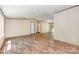 Bright, spacious living room showcasing wood-look floors and neutral walls, creating a welcoming atmosphere at 1785 Doe Ct, Iron Station, NC 28080