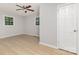Bedroom featuring wood-look floors and two windows for ample natural light at 1874 Sunny Ln, Lancaster, SC 29720