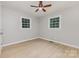 Bedroom with wood-look floors and two windows for ample natural light at 1874 Sunny Ln, Lancaster, SC 29720