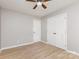 Bedroom with wood-look flooring, ceiling fan, and a double door closet at 1874 Sunny Ln, Lancaster, SC 29720