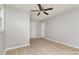 Bedroom with wood-look floors, a double-door closet, and natural light at 1874 Sunny Ln, Lancaster, SC 29720