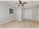 Bedroom with wood-look floors, two windows, and a double-door closet at 1874 Sunny Ln, Lancaster, SC 29720