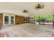 Expansive covered deck with ceiling fans and brick exterior, great for entertaining and enjoying the outdoors at 1874 Sunny Ln, Lancaster, SC 29720
