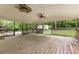 Large covered back deck featuring natural wood and open views of the wooded backyard at 1874 Sunny Ln, Lancaster, SC 29720