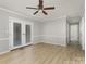 Bright living area featuring wood-look floors and French doors leading to the outdoors at 1874 Sunny Ln, Lancaster, SC 29720
