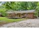 Charming brick home with a covered back porch and spacious backyard at 1874 Sunny Ln, Lancaster, SC 29720