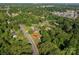 Aerial view of the home nestled among mature trees, with a red arrow indicating the property at 2240 Armstrong Park Dr, Gastonia, NC 28054